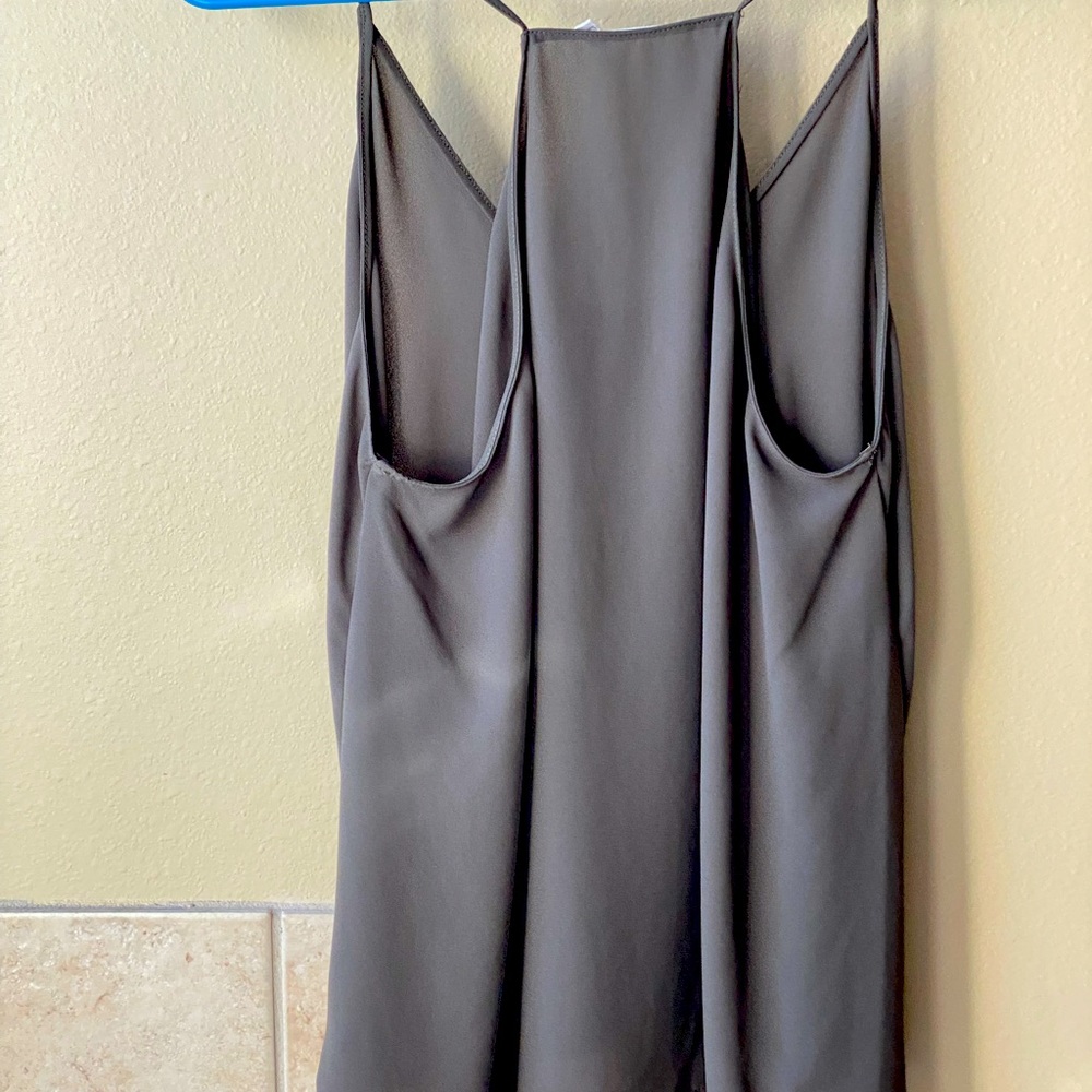 Olive green flows tank top. Hit at hips. Front is a little shorter than back